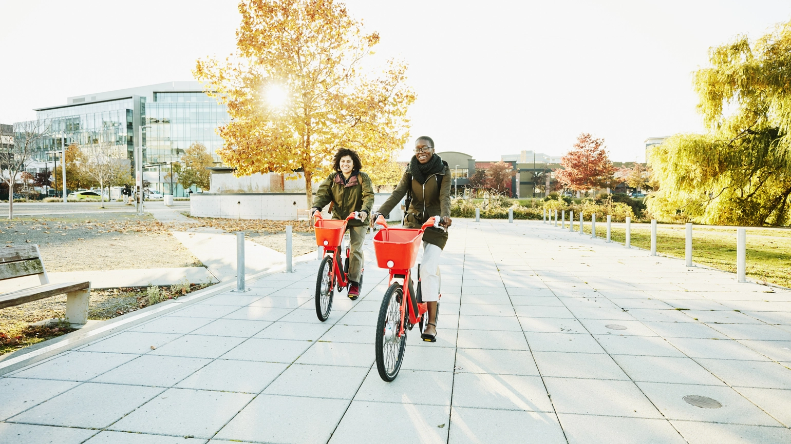 Two female riding a bike in the city Two female riding a bike in the city