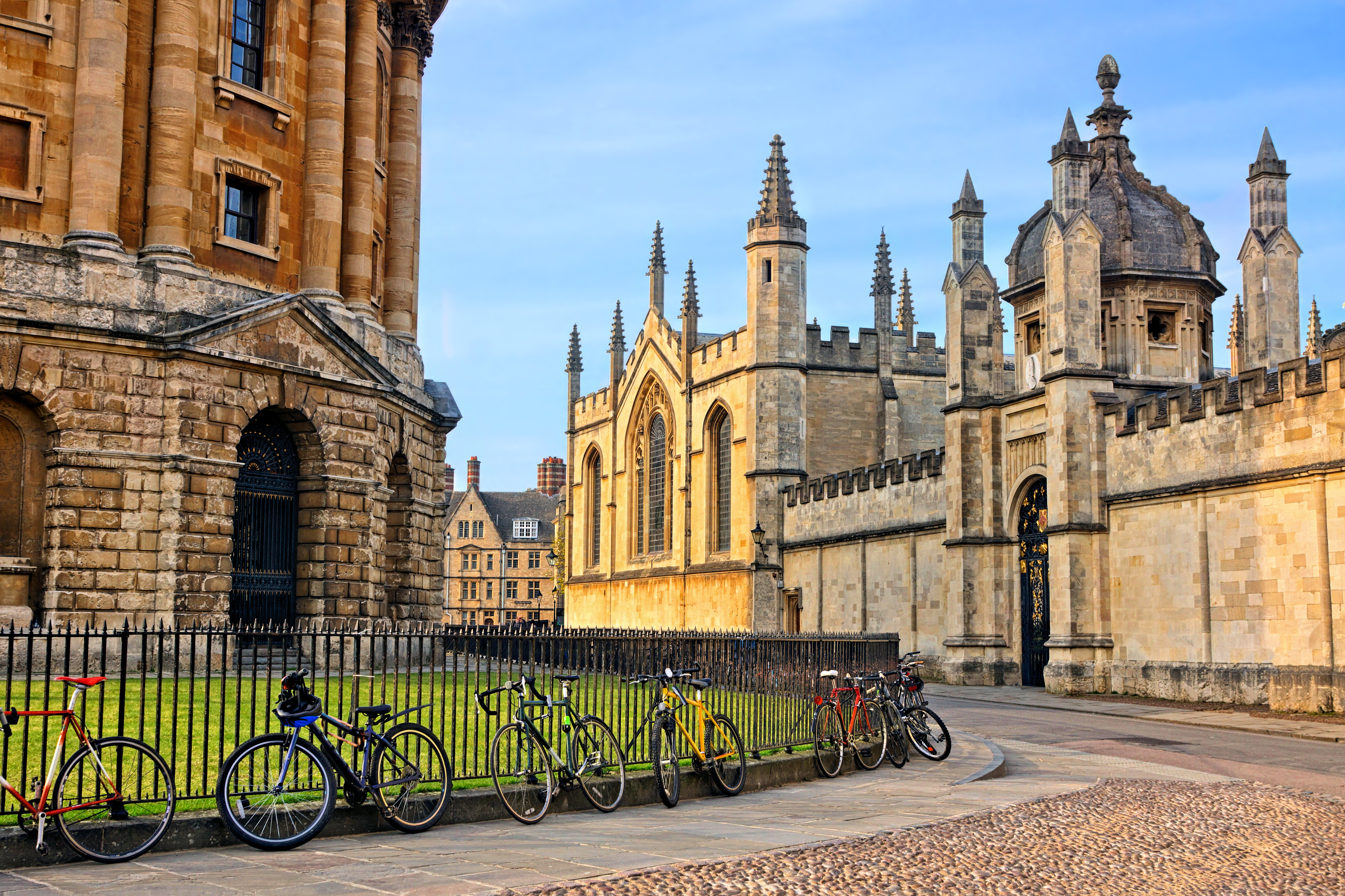 The Radcliffe Camera in Oxford, UK, at dusk with no people around, on a clear day with blue sky.