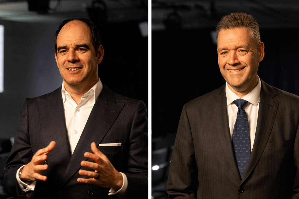 Behind‑the‑scenes style image showing Group CEO, António Simões, and Group CFO, Andrew Kail in separate frames, standing in a darkened events space with the L&G logo projected on the wall behind them. Behind‑the‑scenes style image showing Group CEO, António Simões, and Group CFO, Andrew Kail in separate frames, standing in a darkened events space with the L&G logo projected on the wall behind them.