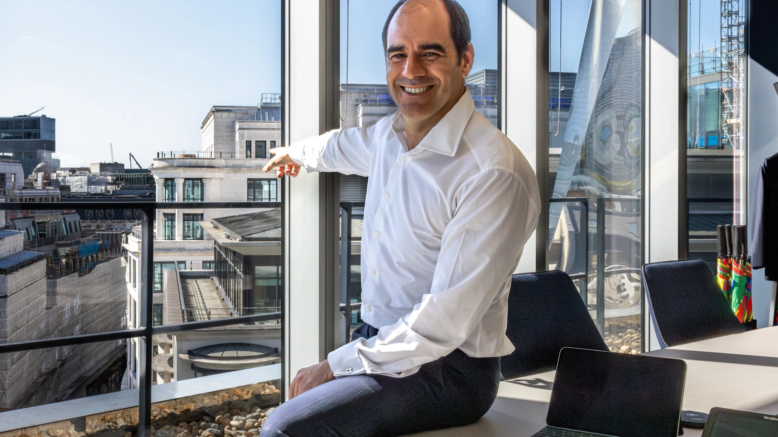From One Coleman Street, CEO António Simões points outside a large window towards Legal & General's new HQ at Woolgate. From One Coleman Street, CEO António Simões points outside a large window towards Legal & General's new HQ at Woolgate.